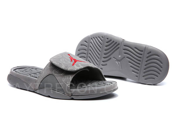 Dép KAWS X Air Jordan 4 Cool Grey Slides